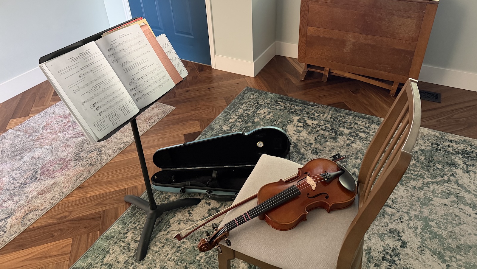 A rented violin and a beginner method book on a music stand